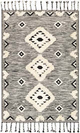 Close-up of the Gardner Cream on Gray Wool Tassel Rug. Hand-woven rug features diamond patterns and decorative tassels. Design-Rectangle-576