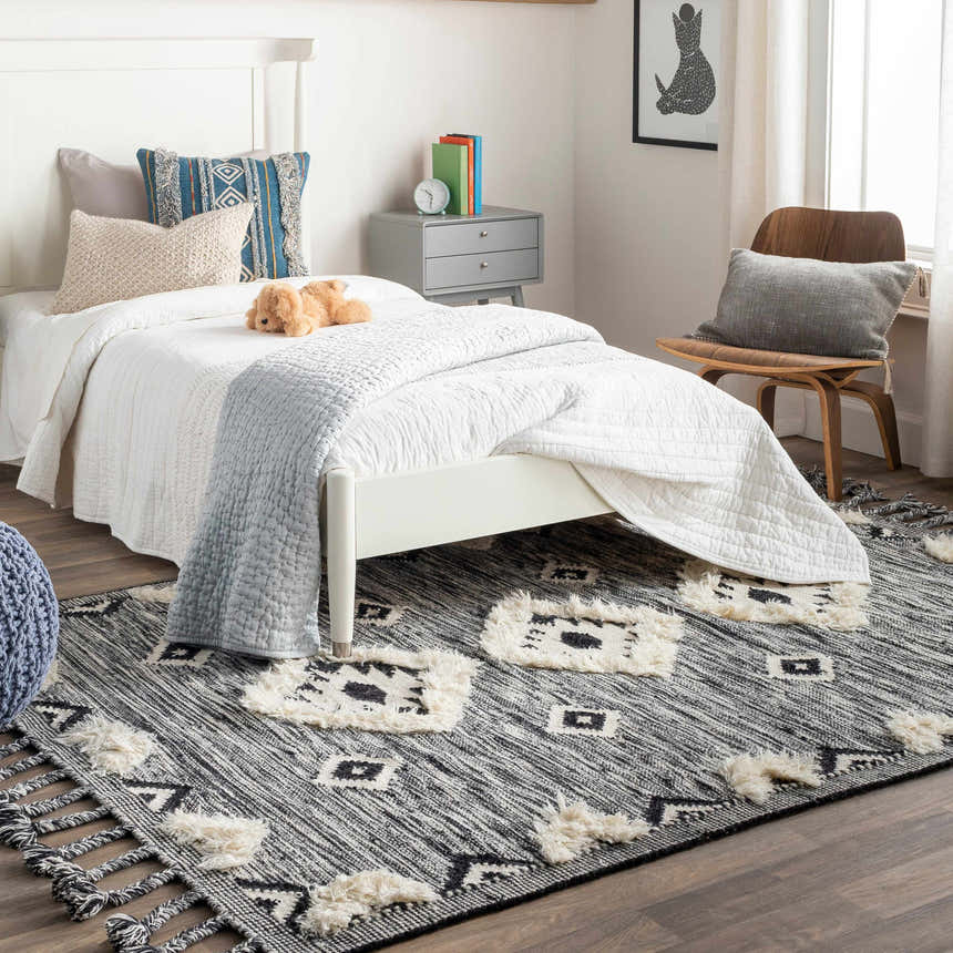Kids bedroom with white bed and Gardner Cream on Gray Wool Tassel Rug, adding a bohemian touch. Roomscene-Rectangle