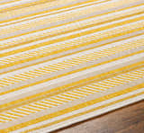 Close-up of Grian Area Rug showing a striped pattern in beige, bone, and gold on a hardwood floor. Texture