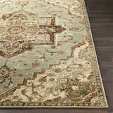 Close-up of the Granger Area Rug. Features a traditional design in burgundy, brown, beige, sage, and tan. Front