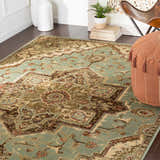 Bohemian style room with a tan pouf and the Granger Area Rug in light beige, sage, and brown. Roomscene-Rectangle