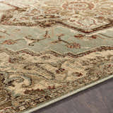 Close-up of the Granger Area Rug. Traditional rug design with burgundy, beige, sage, and brown tones. Texture