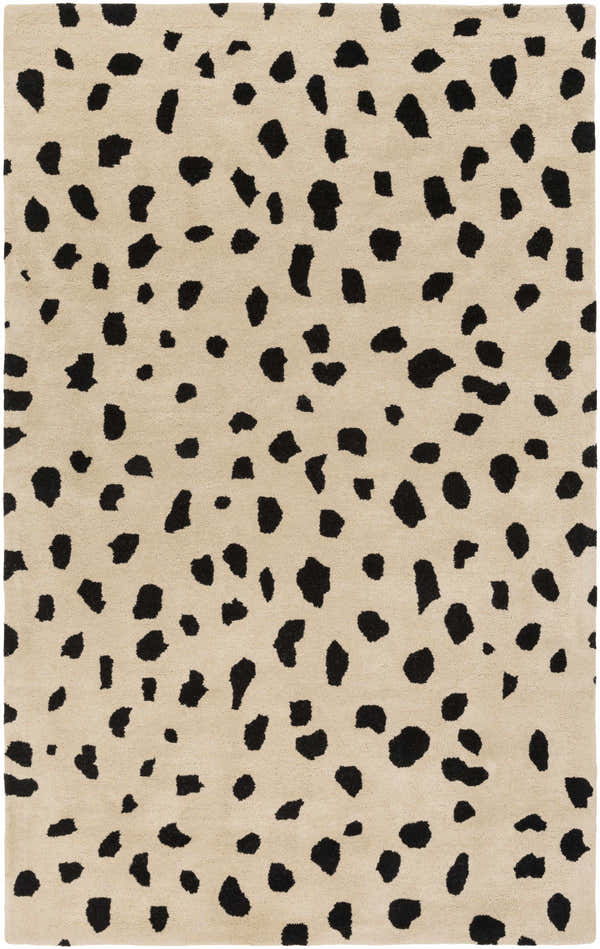 Close-up of the Guiseley Dalmatian Rug. Beige wool rug with a black animal print pattern. Hand-tufted contemporary style. Design-Rectangle-576