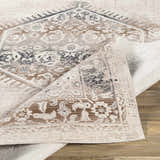 Close-up of the Hainesville White Medallion 10' Runner Rug showing its traditional medallion pattern and neutral beige, brown, and gray tones. Fold