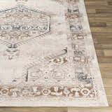 Close-up of Hainesville White Medallion 10' Runner Rug. Farmhouse style rug with traditional brown, gray, and white medallion pattern. Front
