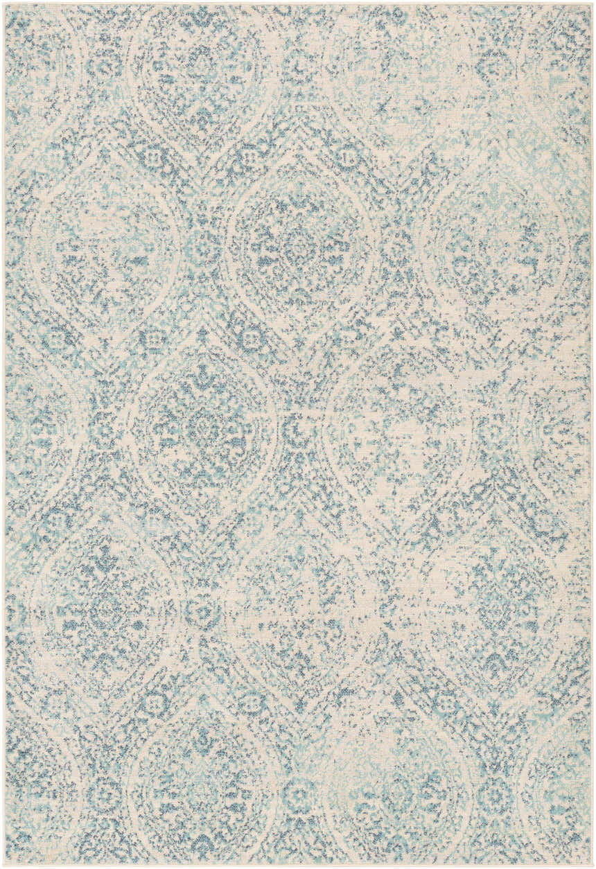 Close-up of the Halbur Area Rug. Aqua, beige, blue, and light gray distressed medallion pattern. Soft texture. Design-Rectangle-5373
