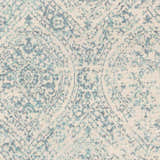 Close-up of the Halbur Area Rug. Beige rug with an aqua and blue distressed, geometric pattern. Swatch