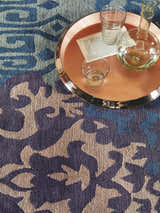 Close-up of the Hallsboro Area Rug. Contemporary design in charcoal, light brown, medium gray, and silverstone. 100% NZ Wool. Styleshot