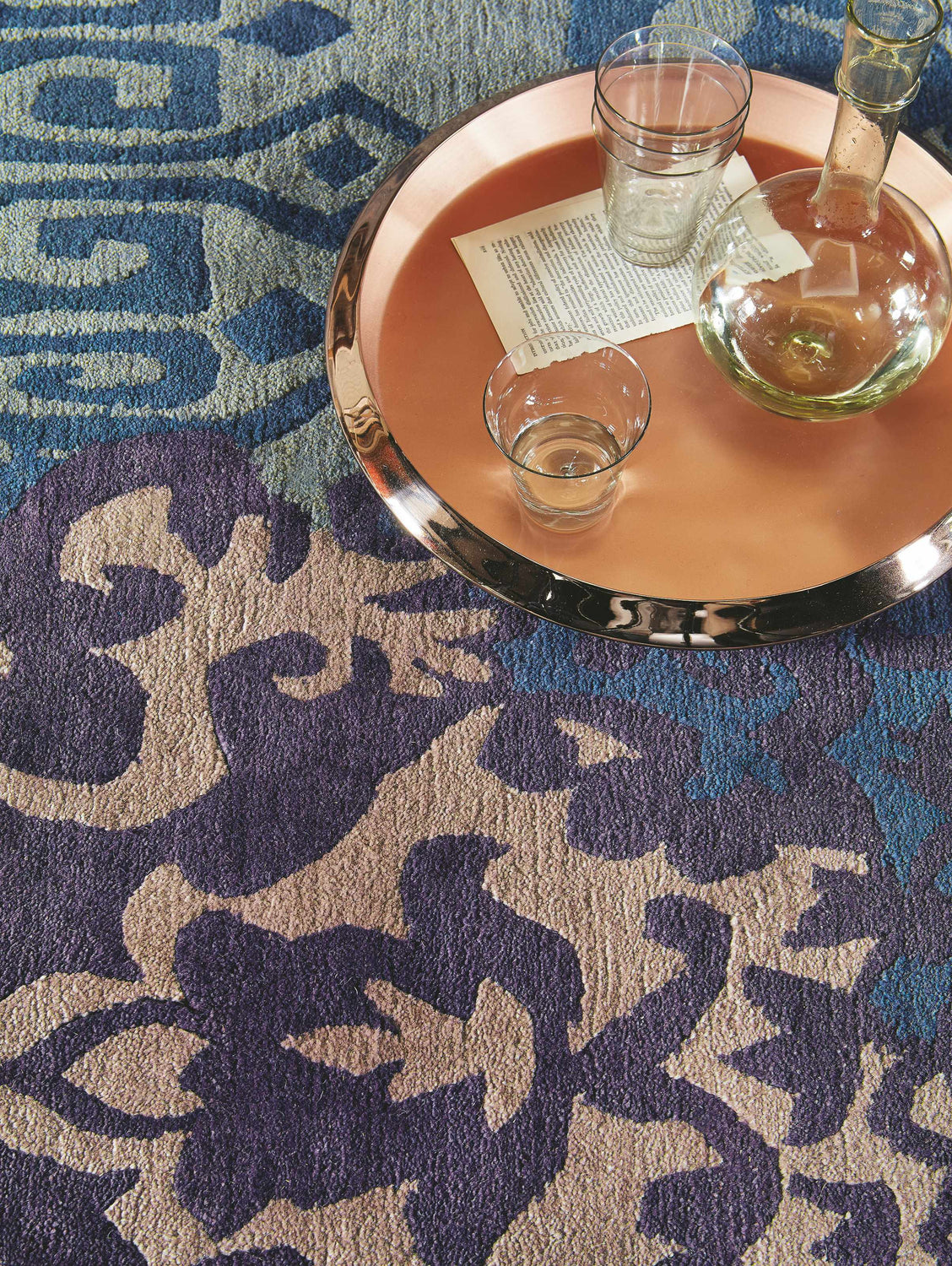 Close-up of the Hallsboro Area Rug. Contemporary design in charcoal, light brown, medium gray, and silverstone. 100% NZ Wool. Styleshot