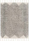 Close-up of the hand-woven Halton Area Carpet. Charcoal chevron pattern on cream cotton with knotted fringe detail. Design-Rectangle-810