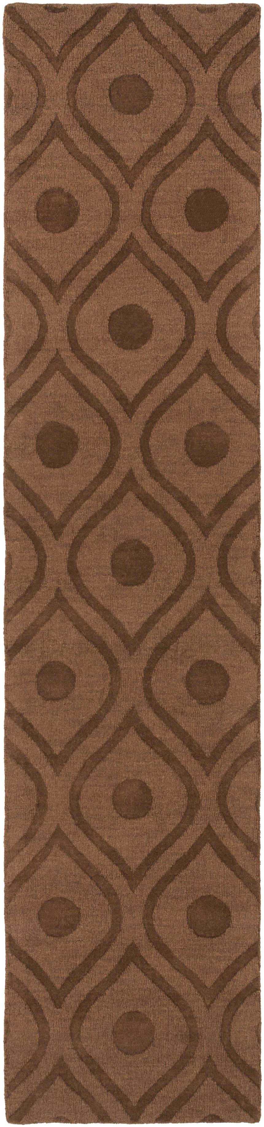 Close-up of the Hamptonville Area Rug. Dark brown wool rug with a contemporary geometric pattern of circles and curved lines. Design-Runner-310