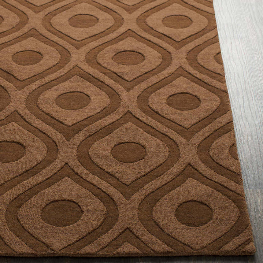 Close-up of the dark brown Hamptonville Area Rug showing its geometric, oval pattern and wool texture. Front