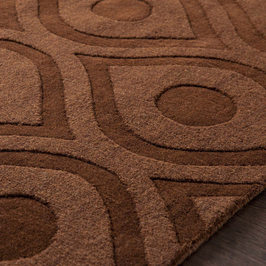 Close-up of the brown Hamptonville Area Rug, showcasing its textured, contemporary circle and line design. Texture
