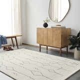 Entryway with beige Hanny Area Rug, wood cabinet, bench, and oval mirror creating a modern farmhouse look. Roomscene-Rectangle