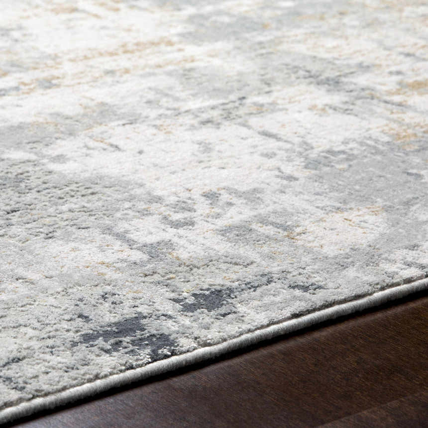 Close up of the Hayle Area Rug showing its charcoal, gray, and off white contemporary design and soft texture. Texture