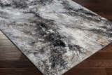 Close-up of the Contemporary Marble Area Rug, featuring a black, gray, and ivory marble-like pattern. Corner