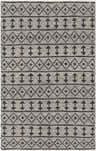 Close-up of the Hector Area Rug, a hand woven rug with black geometric patterns on a light beige background. Design-Rectangle-576