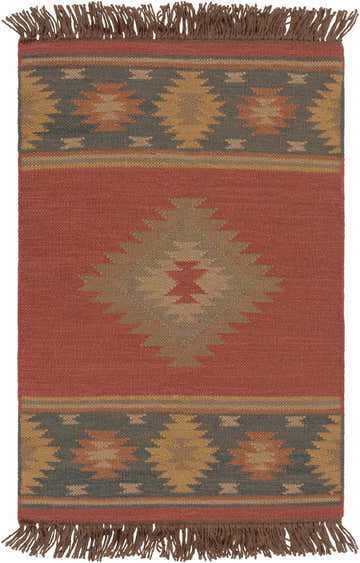 Close-up of the Hedon Wool Area Rug. Brick red rug with a Southwestern-inspired geometric pattern and brown fringe. Design-Rectangle-23