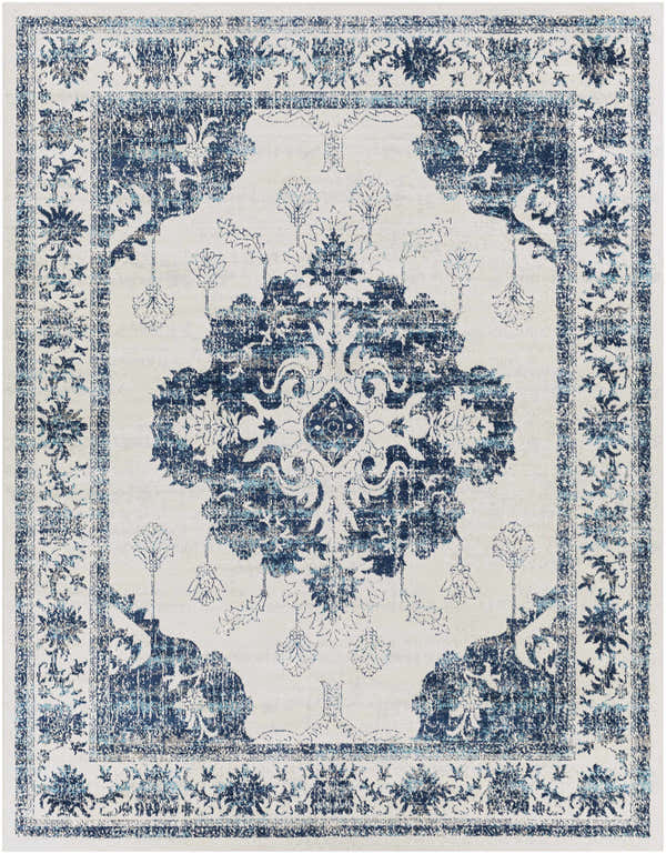 Close-up of the Helidon Area Rug. Features a light beige base with a navy and light blue traditional, floral pattern. Design-Rectangle-71010