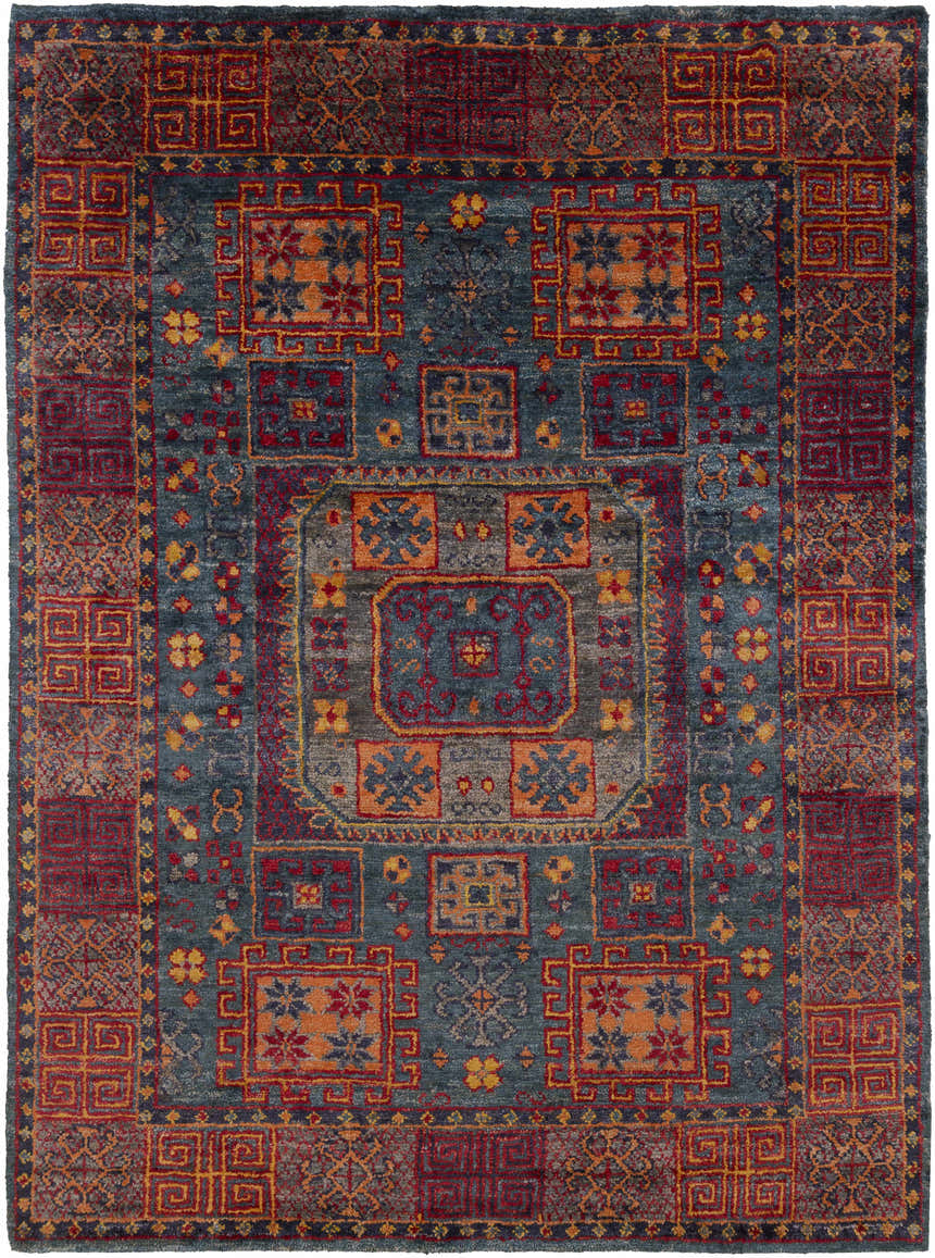 Detailed view of the Herman Jute Carpet, showcasing its burnt orange, red, and navy traditional pattern. Hand-knotted texture. Design-Rectangle-811