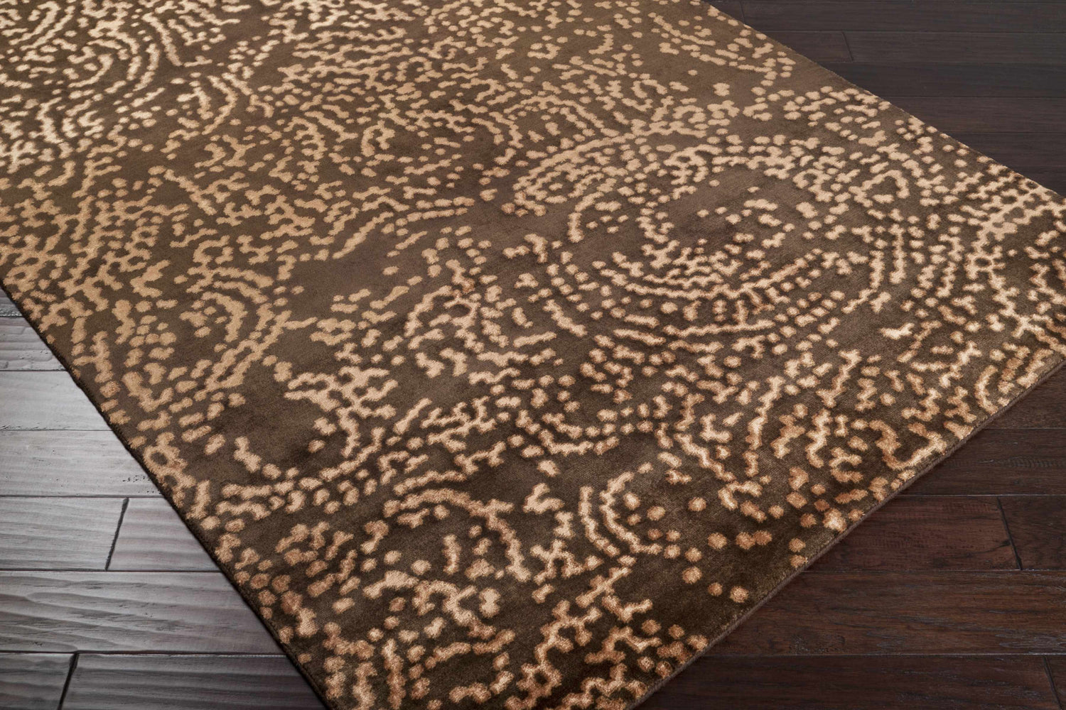 Close-up of the Pensacola 5x8 Brown Premium Wool&Viscose Rug, featuring a beige abstract pattern on a dark brown background. Corner