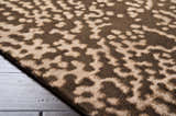Close-up of the Pensacola rug: a brown and beige wool and viscose rug with a contemporary, abstract pattern. Pile