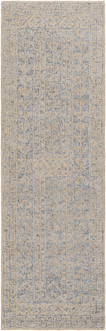 Close up of the hand-tufted Hinton Wool Area Rug, featuring a beige and blue bohemian pattern. Design-Runner-268