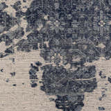 Close-up of the hand-knotted Holmes Carpet. Ivory and navy wool rug with a vintage, distressed bohemian pattern. Front