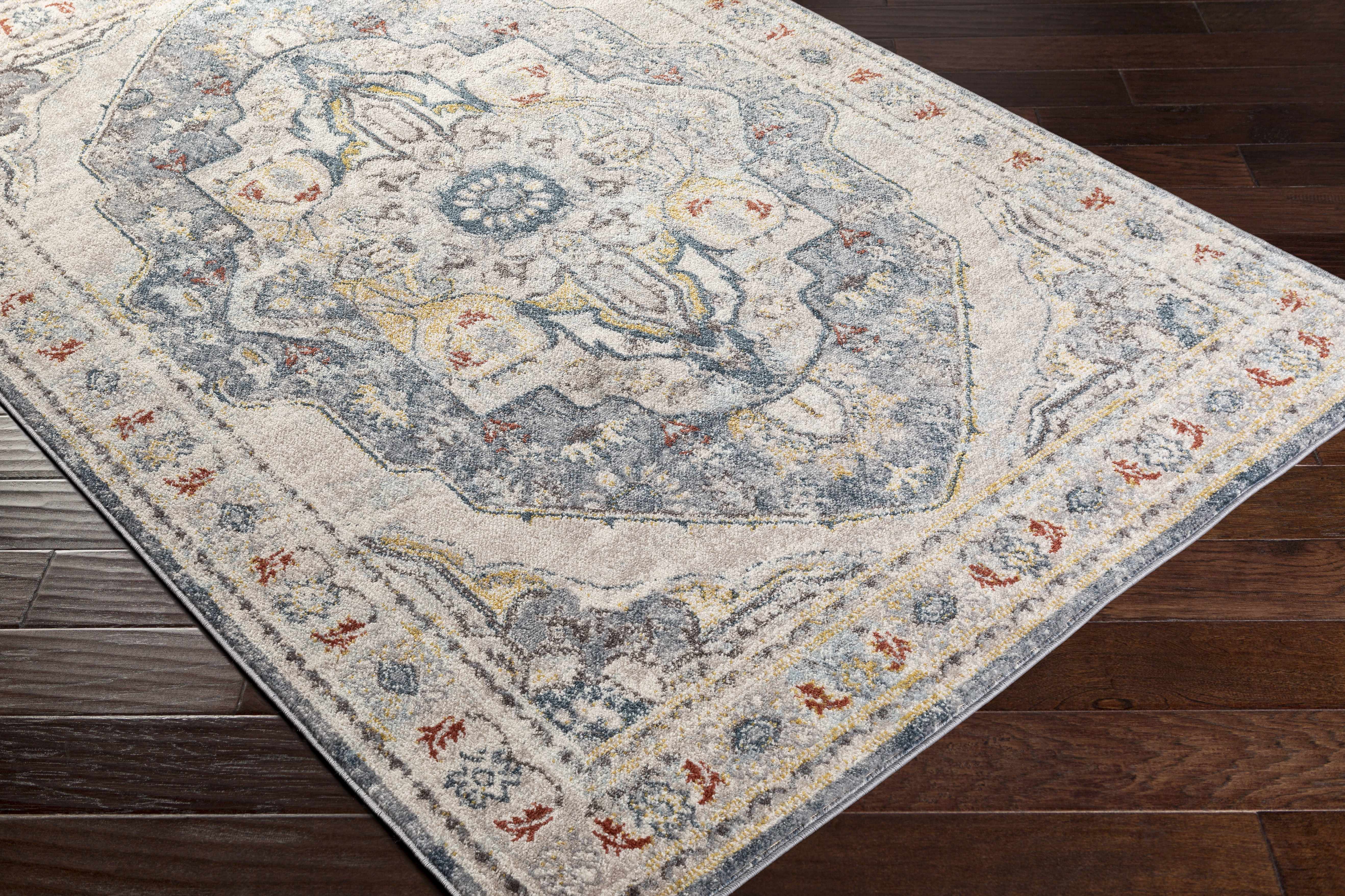 Zoomed-in view of the edge of Hanna Area Rug - Clearance, focusing on border details and craftsmanship. Traditional Area Rug Backing  