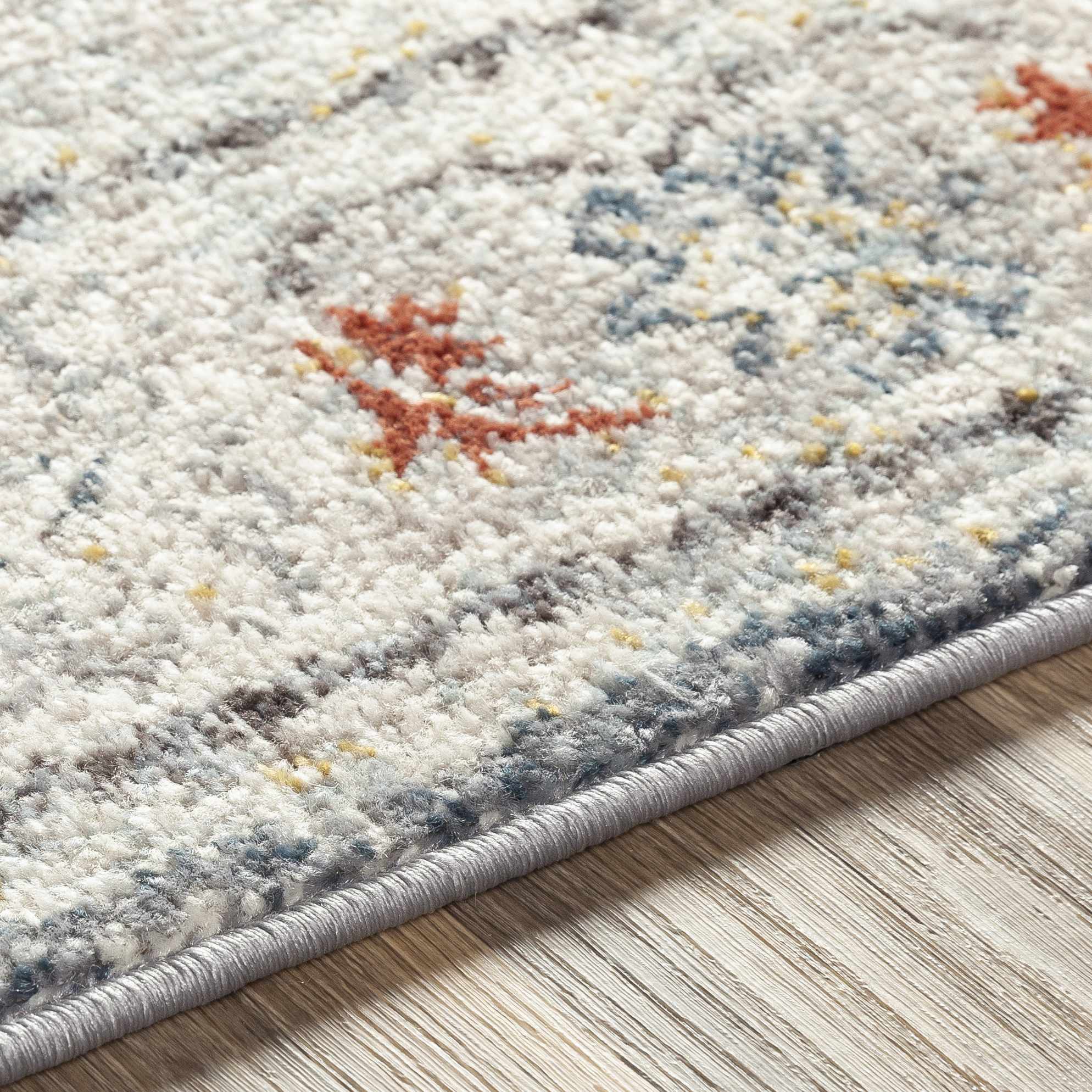 Close-up of the texture on Hanna Area Rug - Clearance, showing fabric weave and feel. Traditional Area Rug Backing  