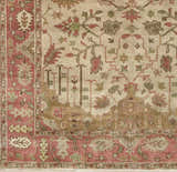 Close-up of the hand-knotted Hobart Area Rug, showcasing its traditional floral pattern and brown, burgundy, and olive tones. Swatch