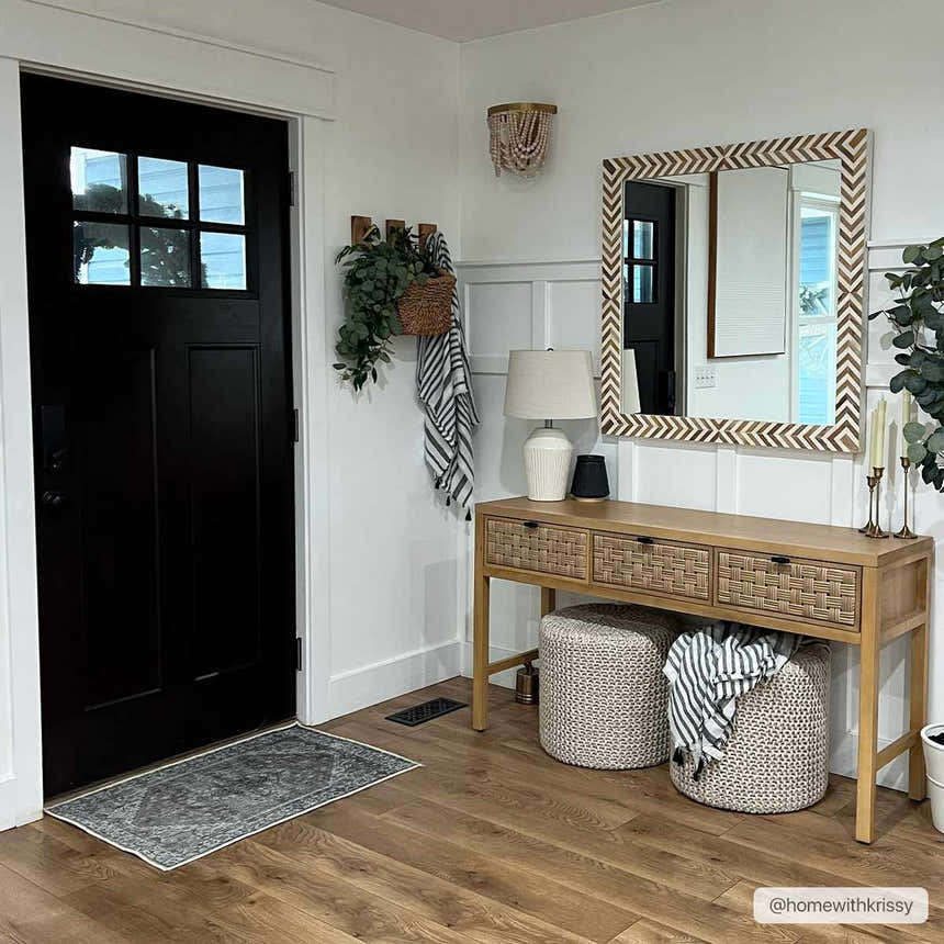 Entryway with wood floors and Athor Washable Rug in dark gray by a black front door. Farmhouse style. Roomscene-Rectangle