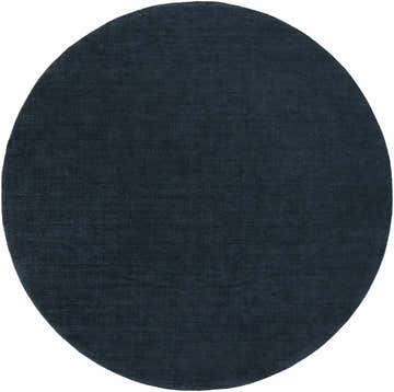 Close-up of a round Brockton Solid Dark Blue Wool Rug showing its texture and navy color. Design-Round-8