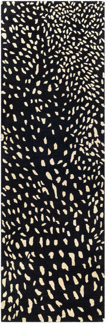 Close-up of the Athena Black Giraffe Print Wool Rug, featuring a beige animal print pattern on black, hand-tufted wool. Design-Runner-268