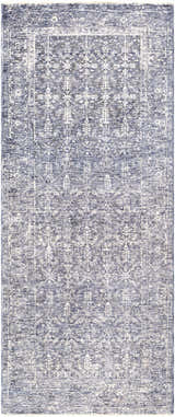 Close-up of the Housatonic Area Rug. Machine-woven polyester rug in denim, light beige, and navy with a traditional oriental pattern. Design-Runner-3310