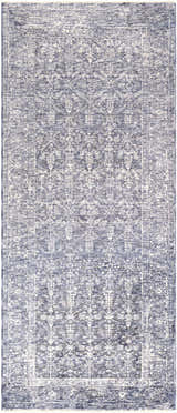 Close-up of the Housatonic Area Rug. Denim, light beige, and navy hues create a traditional oriental pattern. Machine woven polyester. Design-Runner-338