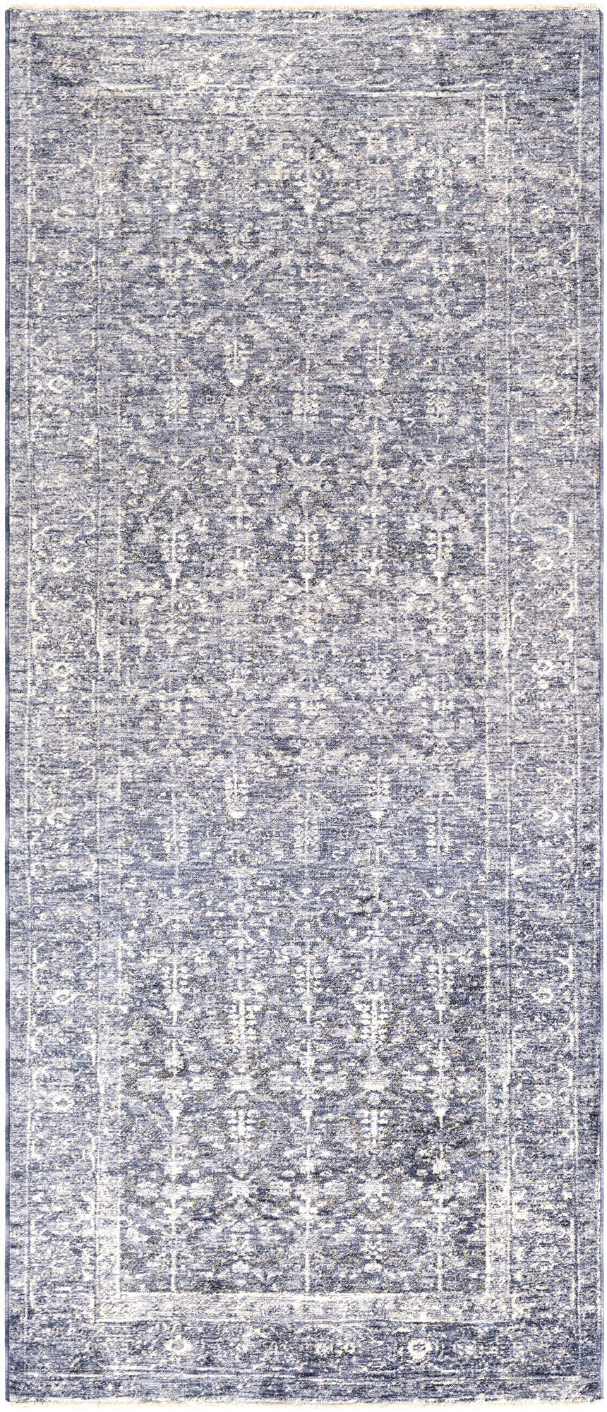 Close-up of the Housatonic Area Rug. Denim, light beige, and navy hues create a traditional oriental pattern. Machine woven polyester. Design-Runner-338