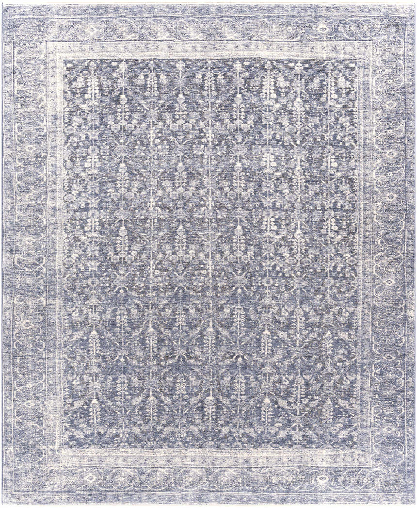 Close-up of the Housatonic Area Rug. Denim, light beige, and navy hues create a traditional oriental rug pattern. Design-Rectangle-810