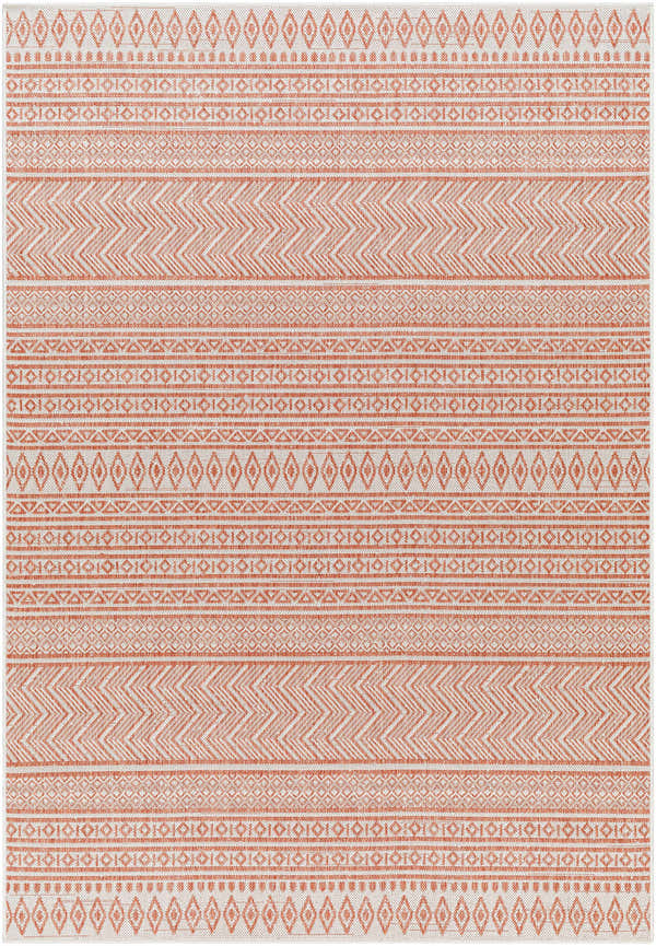 Close-up of the Howie Area Rug, a beige and clay-colored rug with a geometric, farmhouse-style pattern. Design-Rectangle-5377