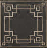 Close-up of Harborcreek Area Rug. Black olefin rug with a light beige geometric Greek key pattern border. Design-Square-89