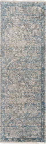 Close-up of the Hartsel Area Rug. Features a traditional, distressed design in charcoal, gray, teal, and navy. Design-Runner