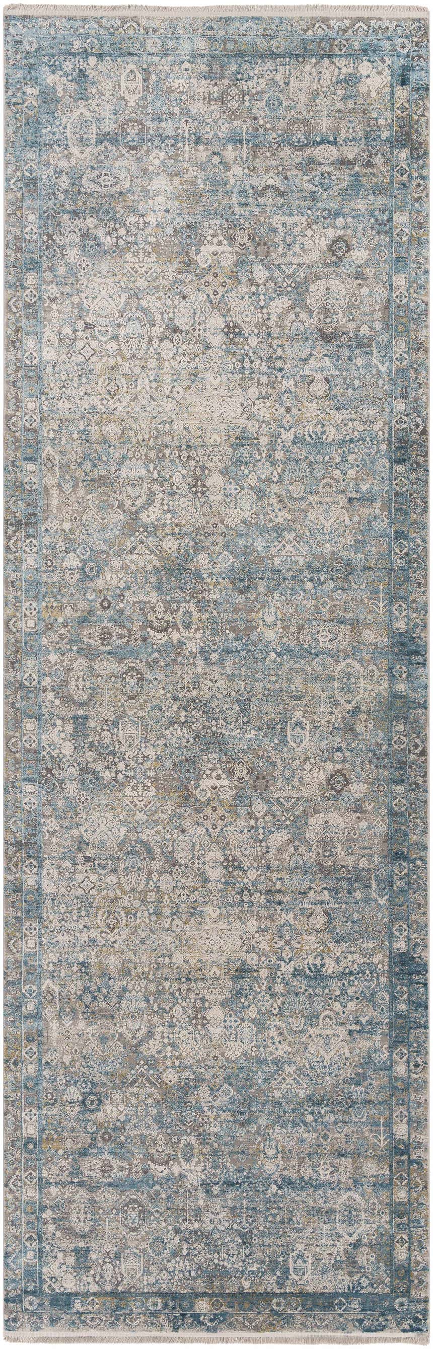 Close-up of the Hartsel Area Rug. Features a traditional, distressed design in charcoal, gray, teal, and navy. Design-Runner