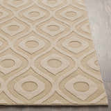 Close-up of the Hundred Area Rug in tan wool with a contemporary geometric pattern on a wood floor. Front