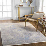 Entryway with gold accents and Akio Blue Area Rug. Farmhouse style with wood floors and natural light. Roomscene-Rectangle