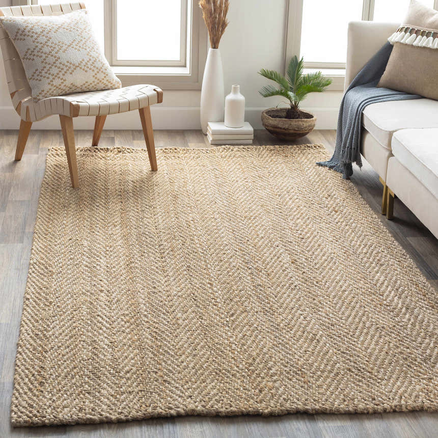 Living room scene with a tan Inchinnan Jute Rug, white sofa, and natural decor. Farmhouse style. Roomscene-Rectangle