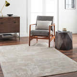 Living room scene with a gray chair and the Indah Thick Luxe Area Rug in cloud gray and light gray. Roomscene-Rectangle