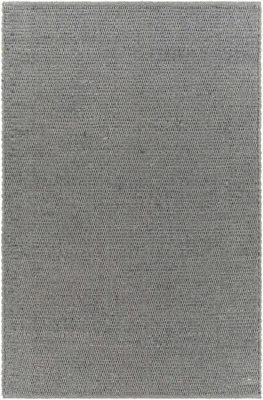 Close-up of the gray Innisfail Area Rug, a hand-woven, solid-color rug with a subtle striped texture. Design-Rectangle-576