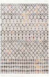 Close-up of the Itogon Area Rug. Bohemian geometric pattern in black, brick red, burnt orange, teal, and gray with fringe. Design-Rectangle-537