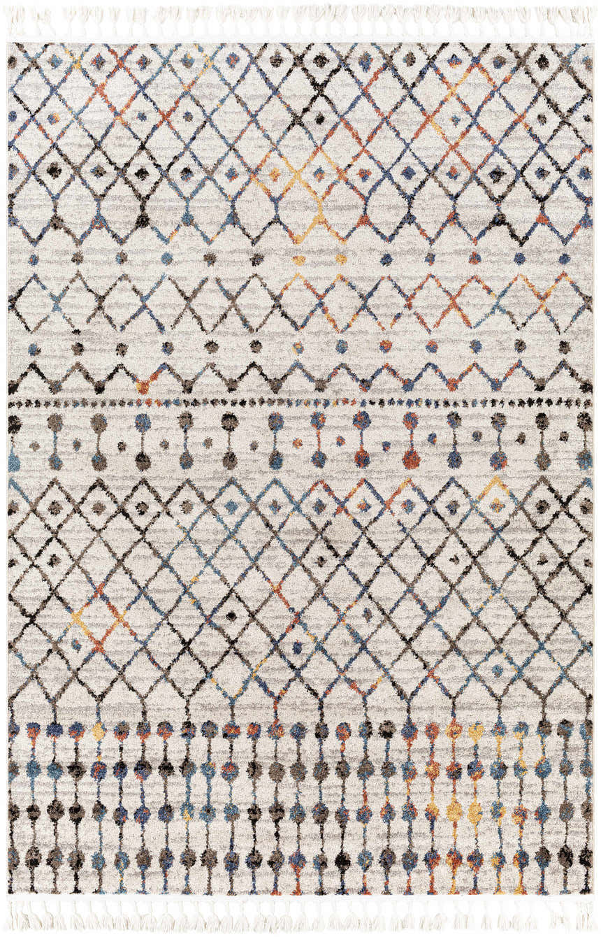 Close-up of the Itogon Area Rug. Bohemian geometric pattern in black, brick red, burnt orange, teal, and gray with fringe. Design-Rectangle-537