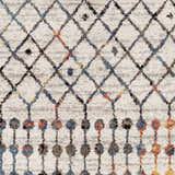Close-up of the Itogon Area Rug. Geometric diamond pattern in black, brick red, burnt orange, teal, and gray on a light gray base. Swatch